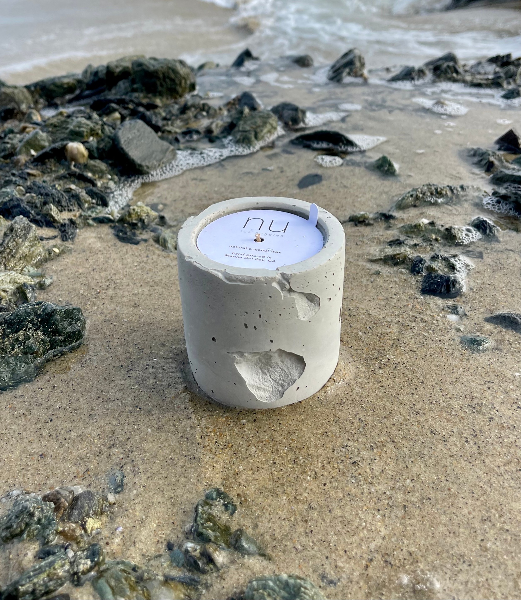 candle in beach setting